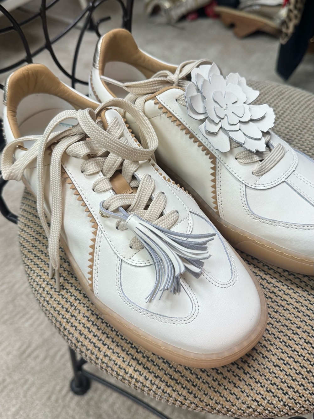 White Leather Lace-Up Sneakers with Tan Trim and Floral Tassel Accent